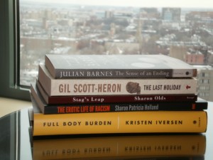 The books that I acquired at MLA with the view of downtown Boston from my hotel room window in the background.