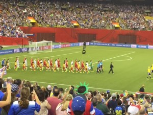 The two teams walking out onto the pitch before the match. The crowd was so loud that it drowned out the beginning of "The Star-Spangled Banner."